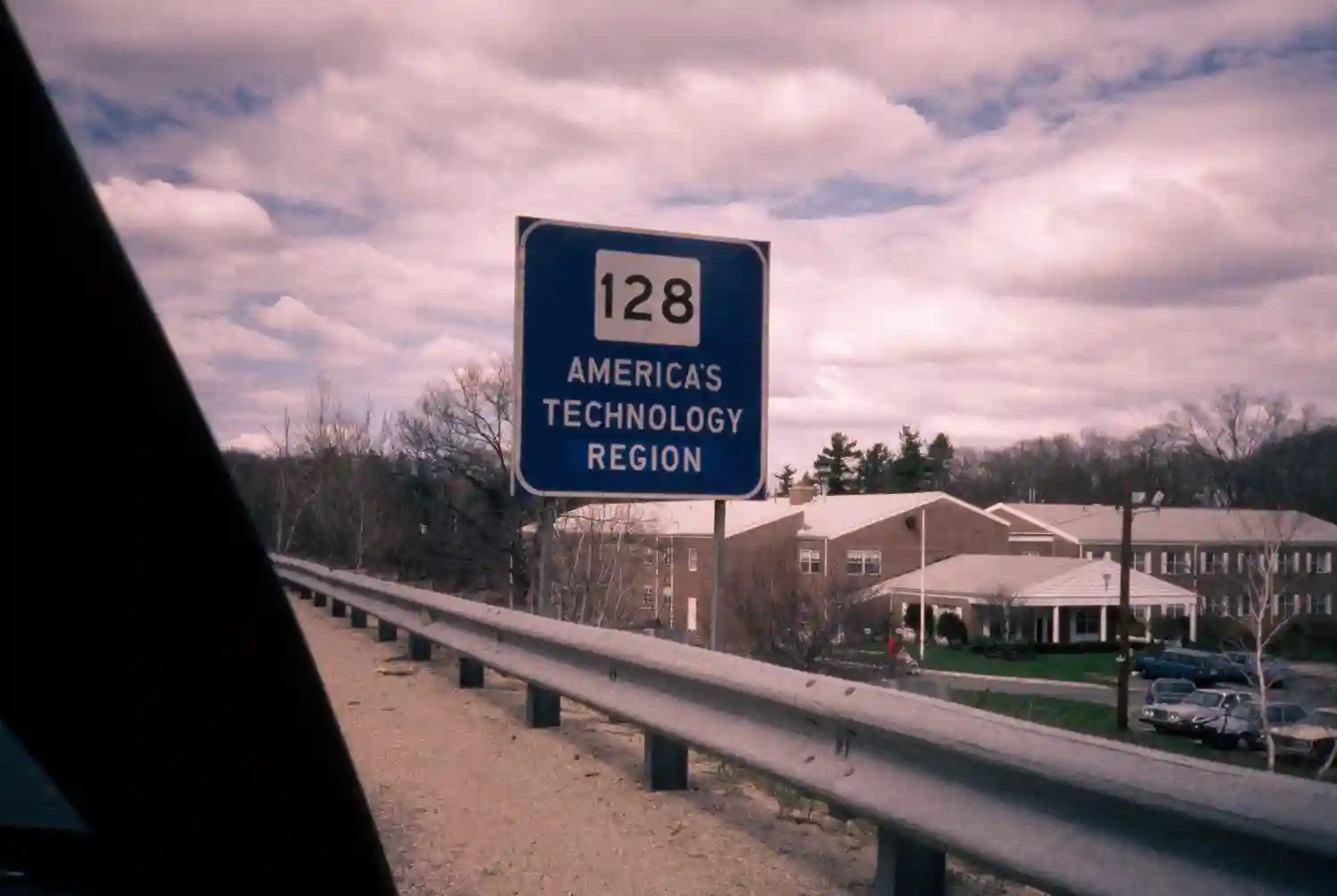 Highway sign for Route 128 reading "AMERICA'S TECHNOLOGY REGION" on the side of the road.