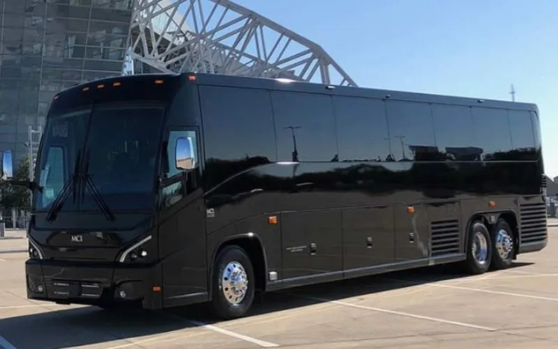 Front three-quarter view of a black 40 PAX Motor Coach for large group executive travel