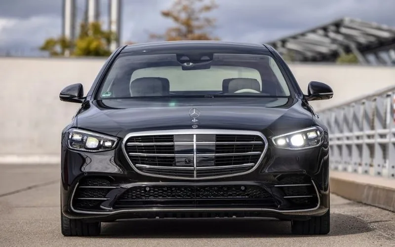Front view of a black Mercedes-Benz S-Class highlighting the iconic grille and LED headlights