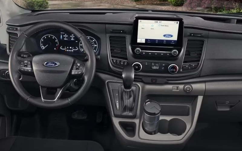 Integrated bar and entertainment console inside a luxury Mercedes-Benz Sprinter Van