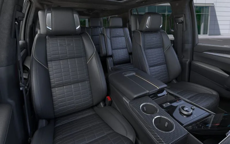 Interior view of Cadillac Escalade's three-row seating with black quilted leather upholstery