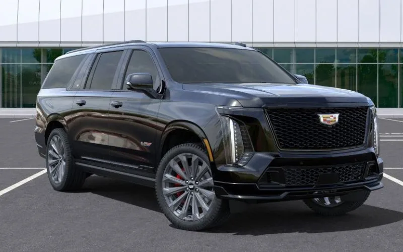 Side profile of a black Cadillac Escalade highlighting its long wheelbase and dark alloy wheels