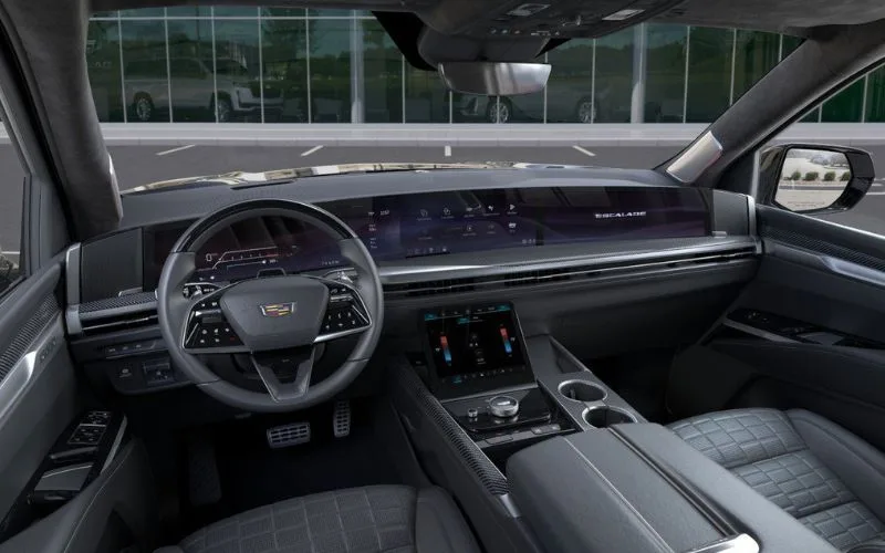 Wide-angle view of the Cadillac Escalade dashboard, infotainment screens, and center console