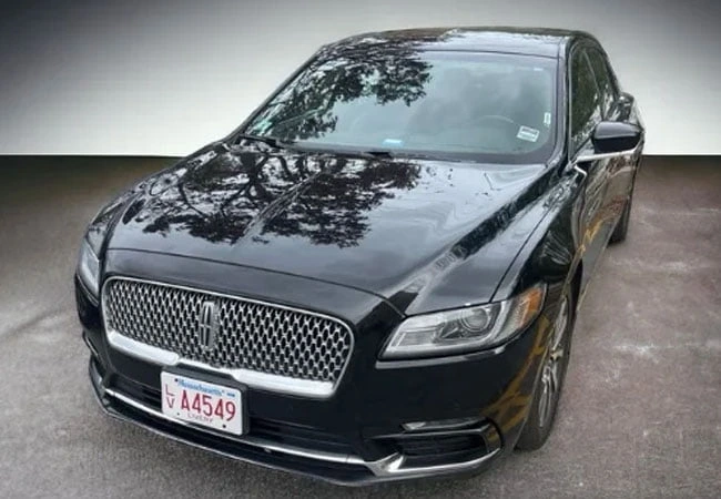 front view of a black lincoln luxury sedan