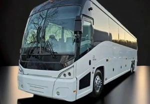 White luxury motor coach for charter and group transportation